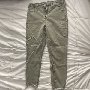 Mossimo sage green jeans size 10 with frayed ends and bleach splatter details